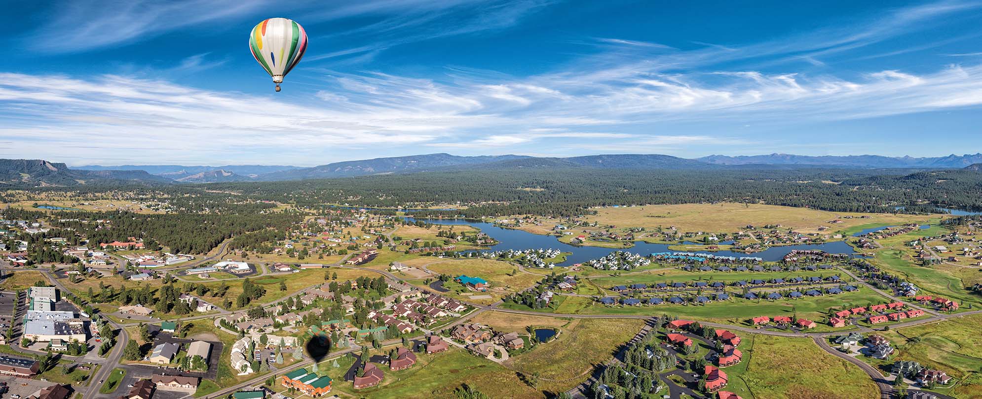 A hot air balloon flies over Pagosa Springs, Colorado.